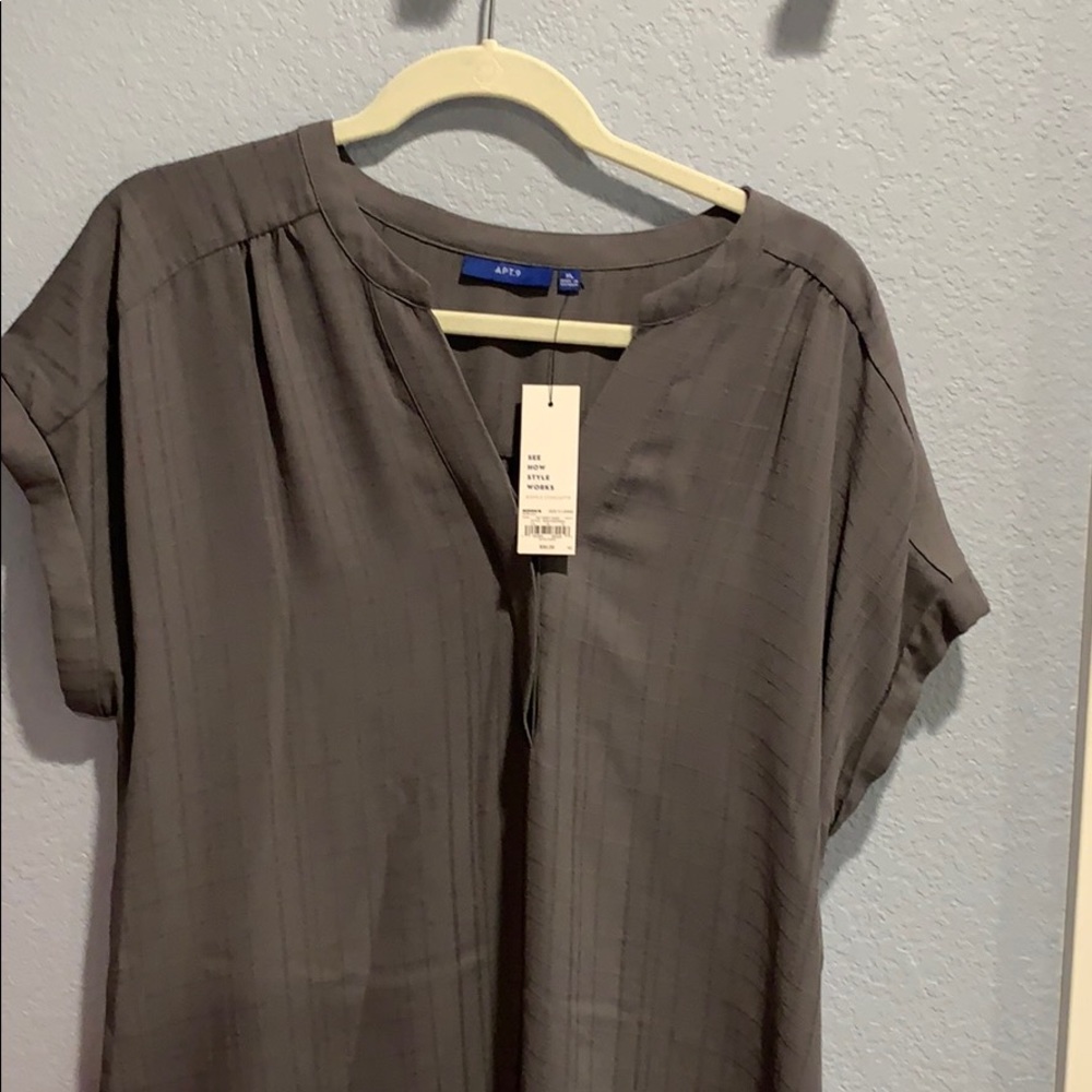 Never worn short sleeve women’s blouse
